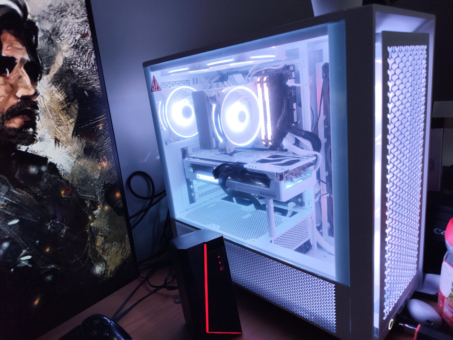 White gaming PC build with illuminated fans and components